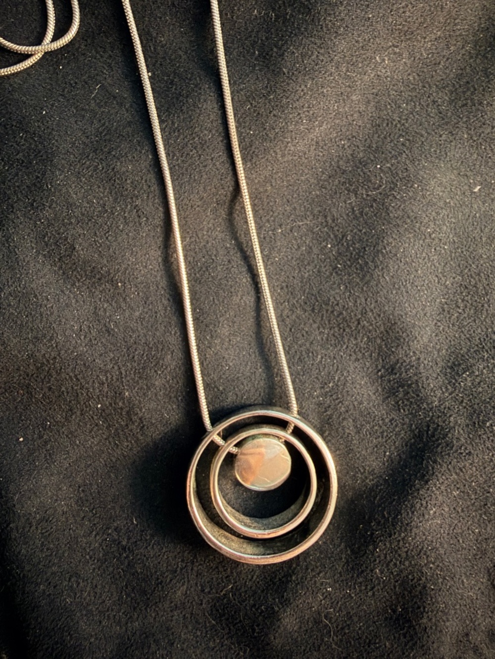 Three ring silver pendant necklace
